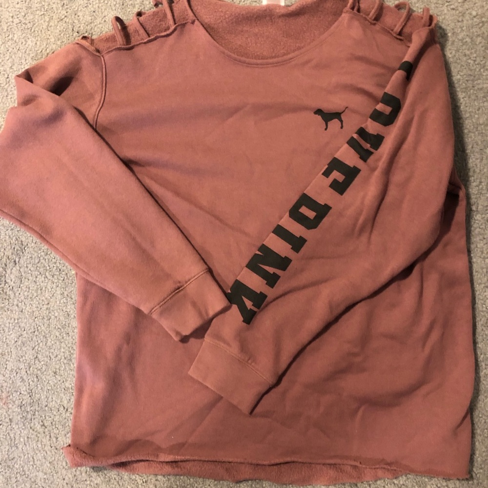 Pink sweatshirt with cut out at shoulders